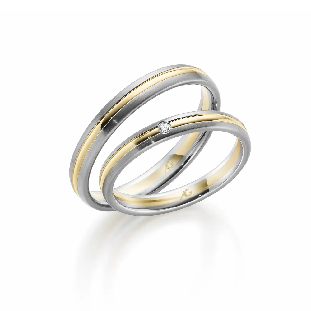 Alianzas de boda de paladio y oro amarillo con diamante