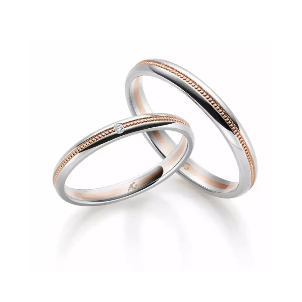 Alianzas de boda de oro blanco y oro rosado con diamante