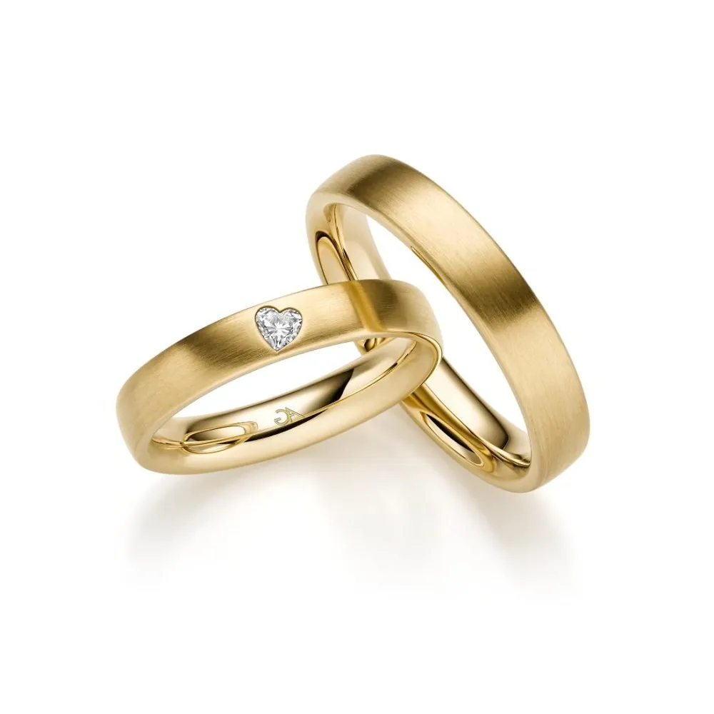 Alianzas de boda de oro amarillo con diamante