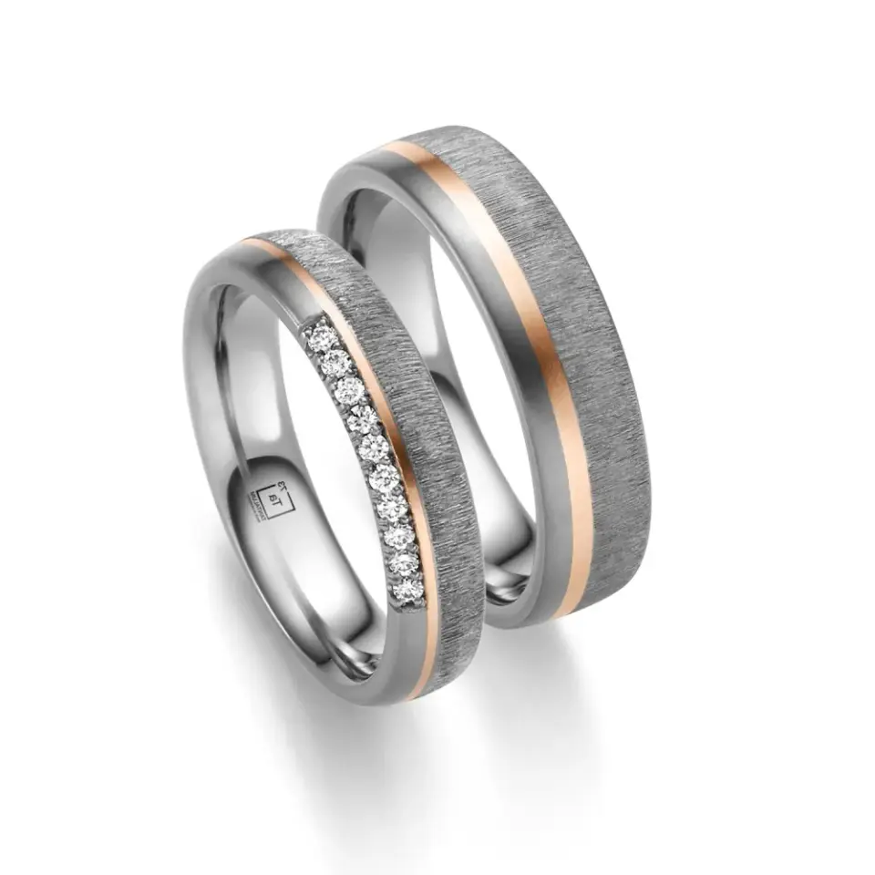 Alianzas de boda de tántalo y oro rosado con diamantes