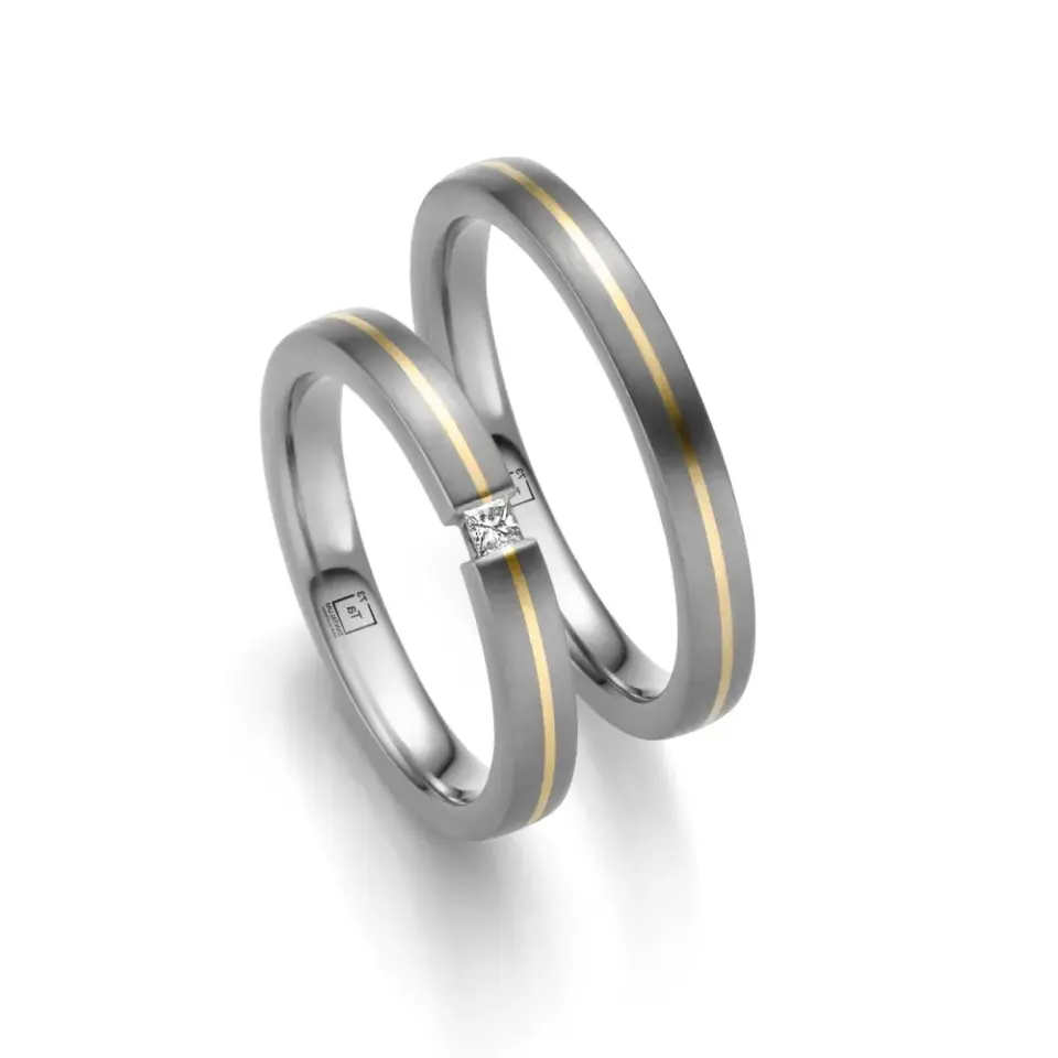 Alianzas de boda de tántalo y oro amarillo con diamante