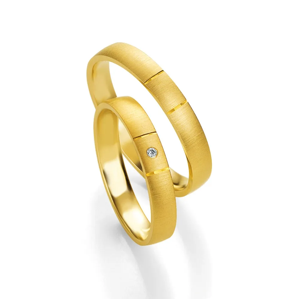 Alianzas de boda de oro amarillo con diamante