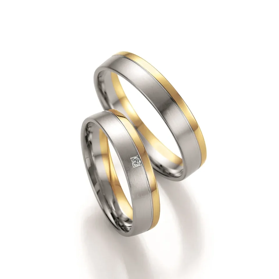 Alianzas de boda de paladio y oro amarillo con diamante