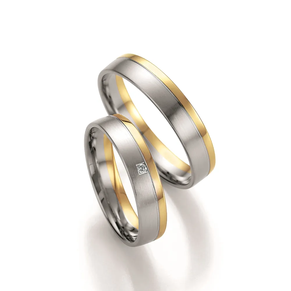 Alianzas de boda de paladio y oro amarillo con diamante