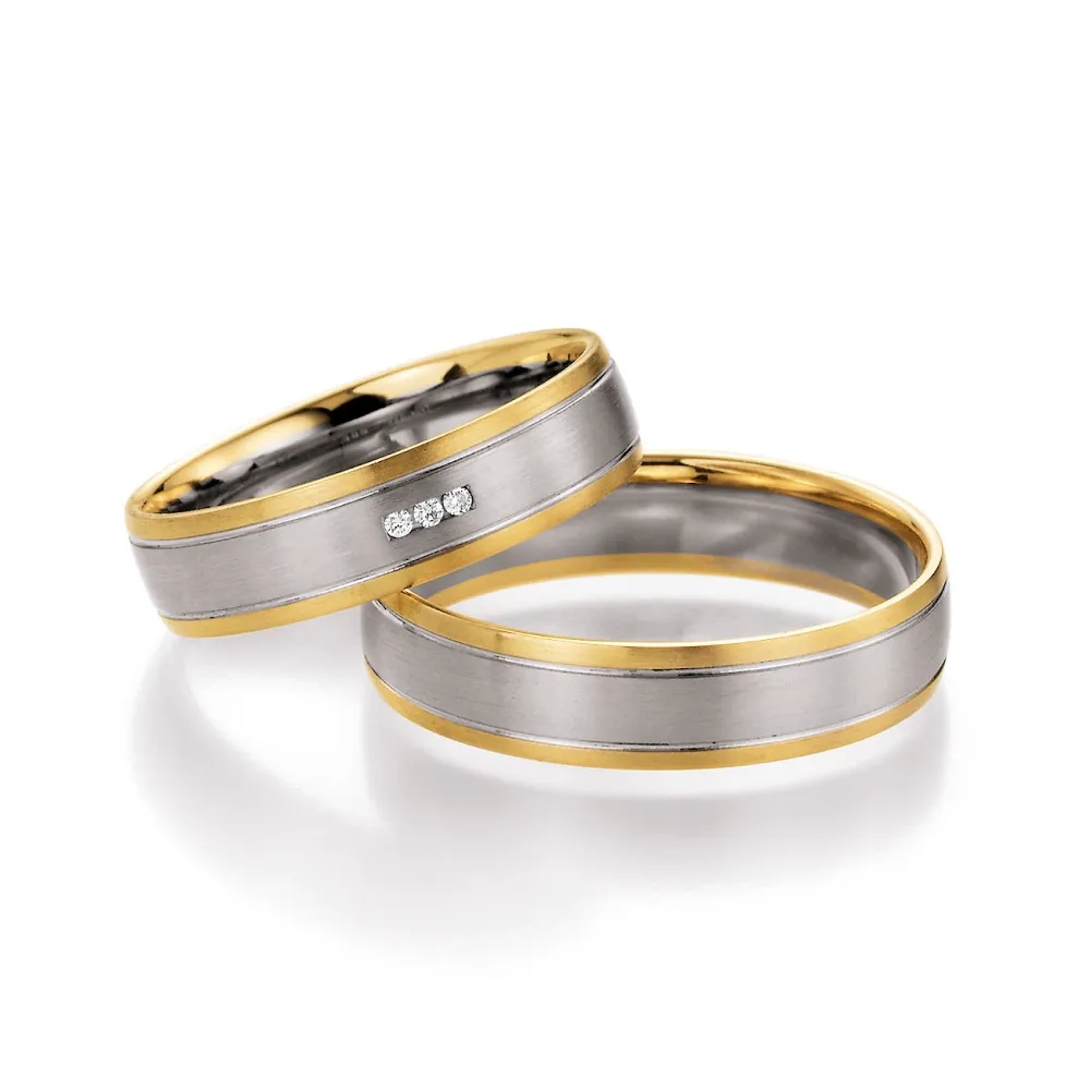 Alianzas de boda de oro amarillo y paladio con diamantes