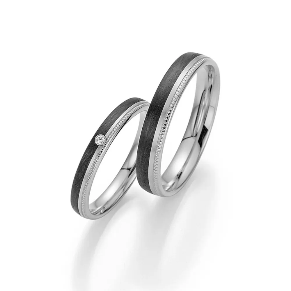 Alianzas de boda de platino y carbono con diamante