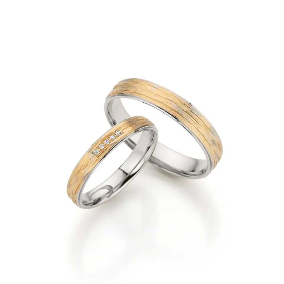 Alianzas de boda de platino y oro albaricoque con diamantes