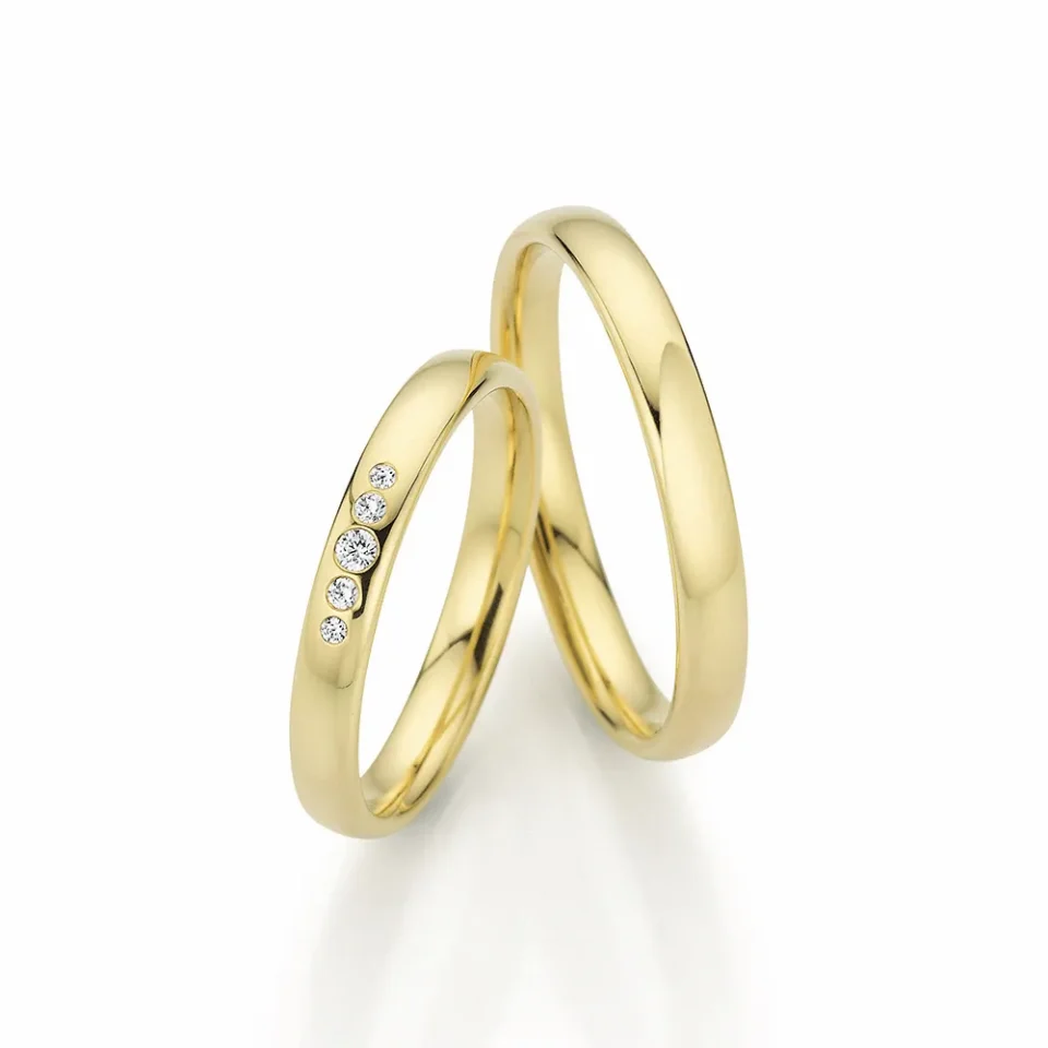 Alianzas de boda de oro amarillo con diamantes