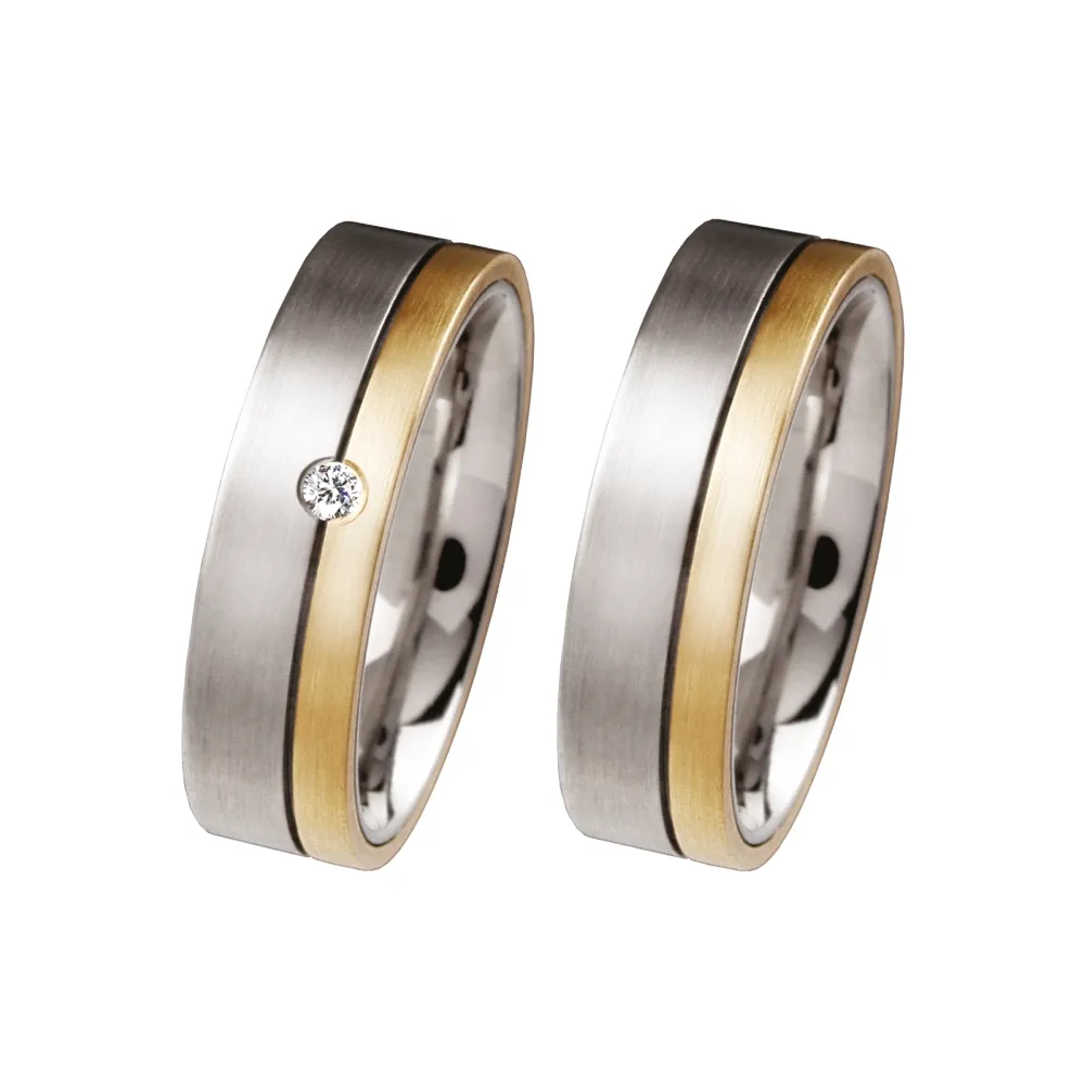 Alianzas de boda de acero y oro amarillo con diamante