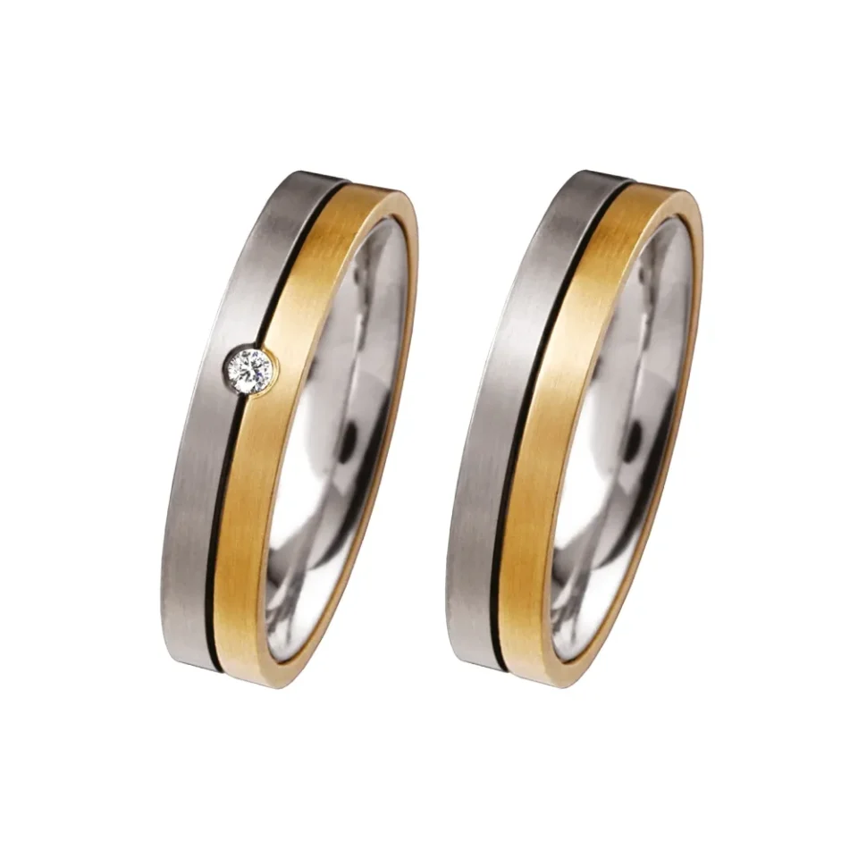 Alianzas de boda de acero y oro amarillo con diamante