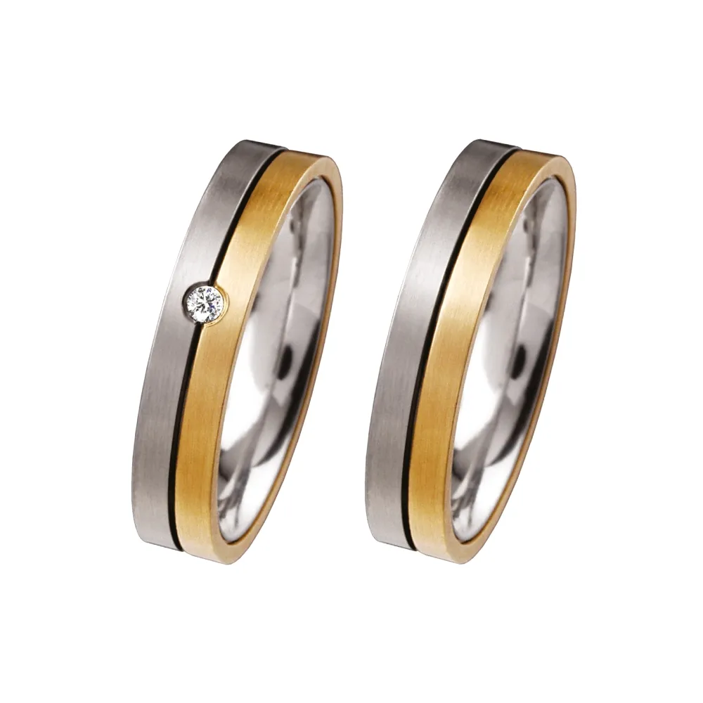 Alianzas de boda de acero y oro amarillo con diamante