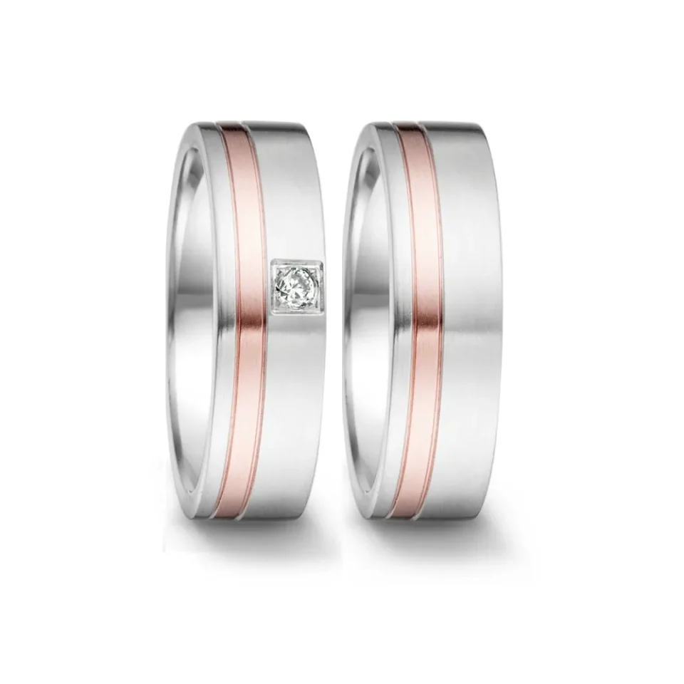Alianzas de boda de acero y oro rosado con diamante