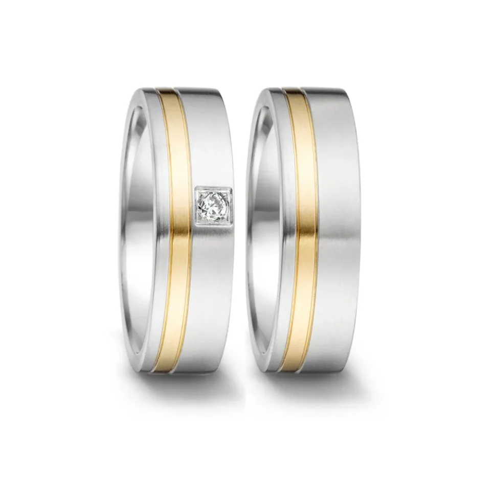Alianzas de boda de acero y oro amarillo con diamante
