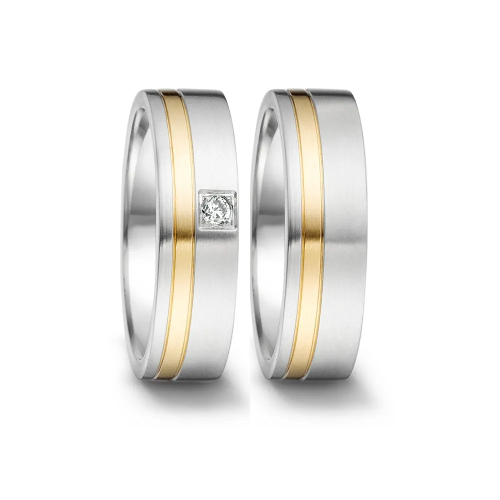 Alianzas de boda de acero y oro amarillo con diamante