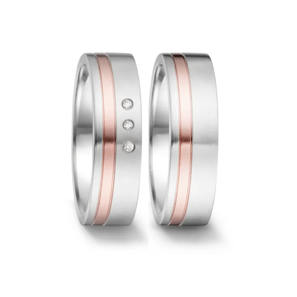 Alianzas de boda de acero y oro rosado con diamantes