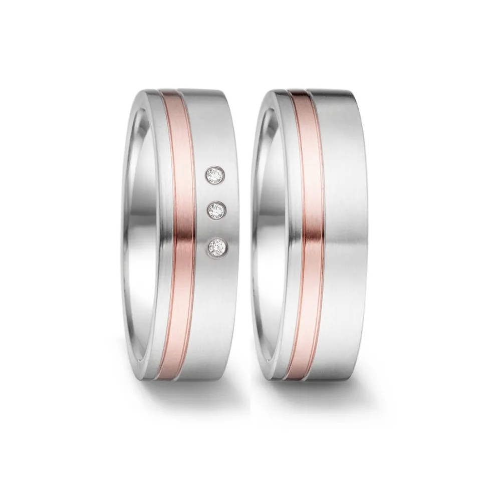 Alianzas de boda de acero y oro rosado con diamantes