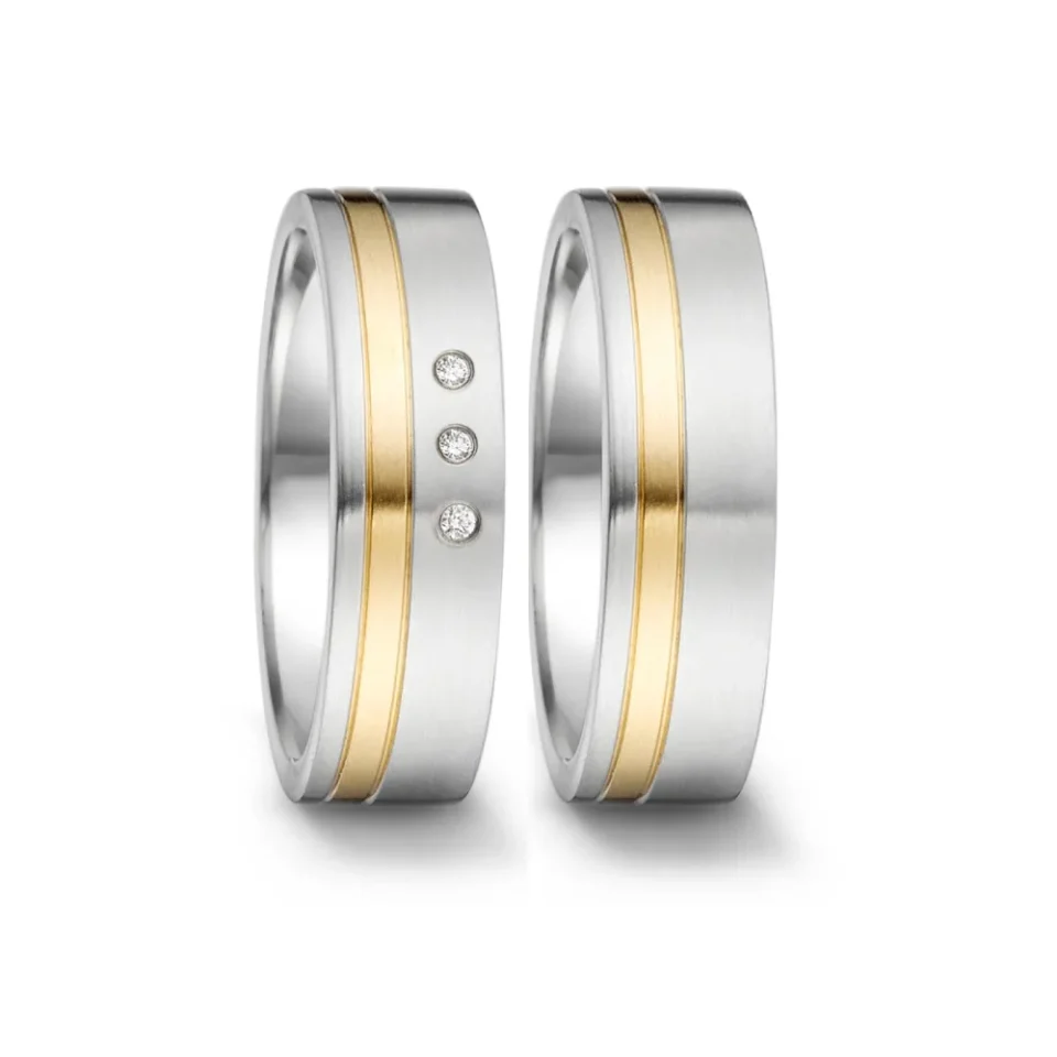 Alianzas de boda de acero y oro amarillo con diamantes