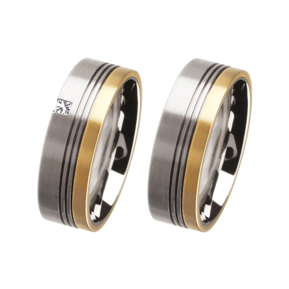 Alianzas de boda de acero y oro amarillo con diamante