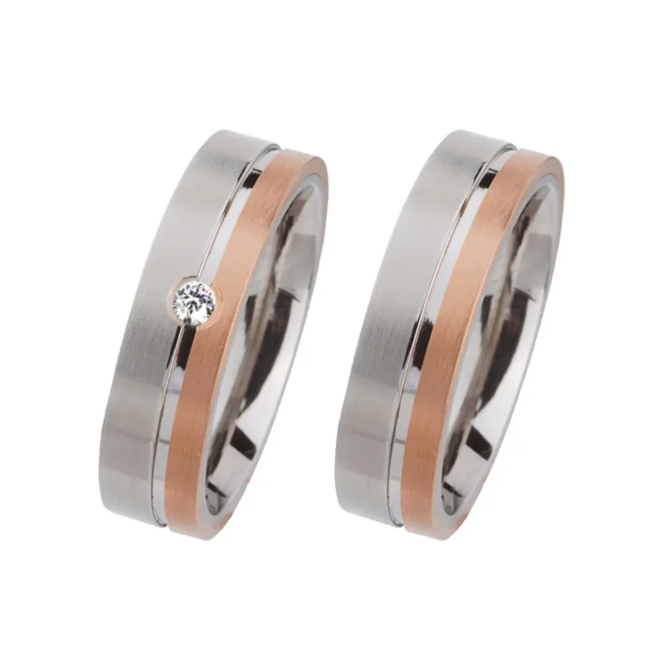 Alianzas de boda de acero y oro rosado con diamante