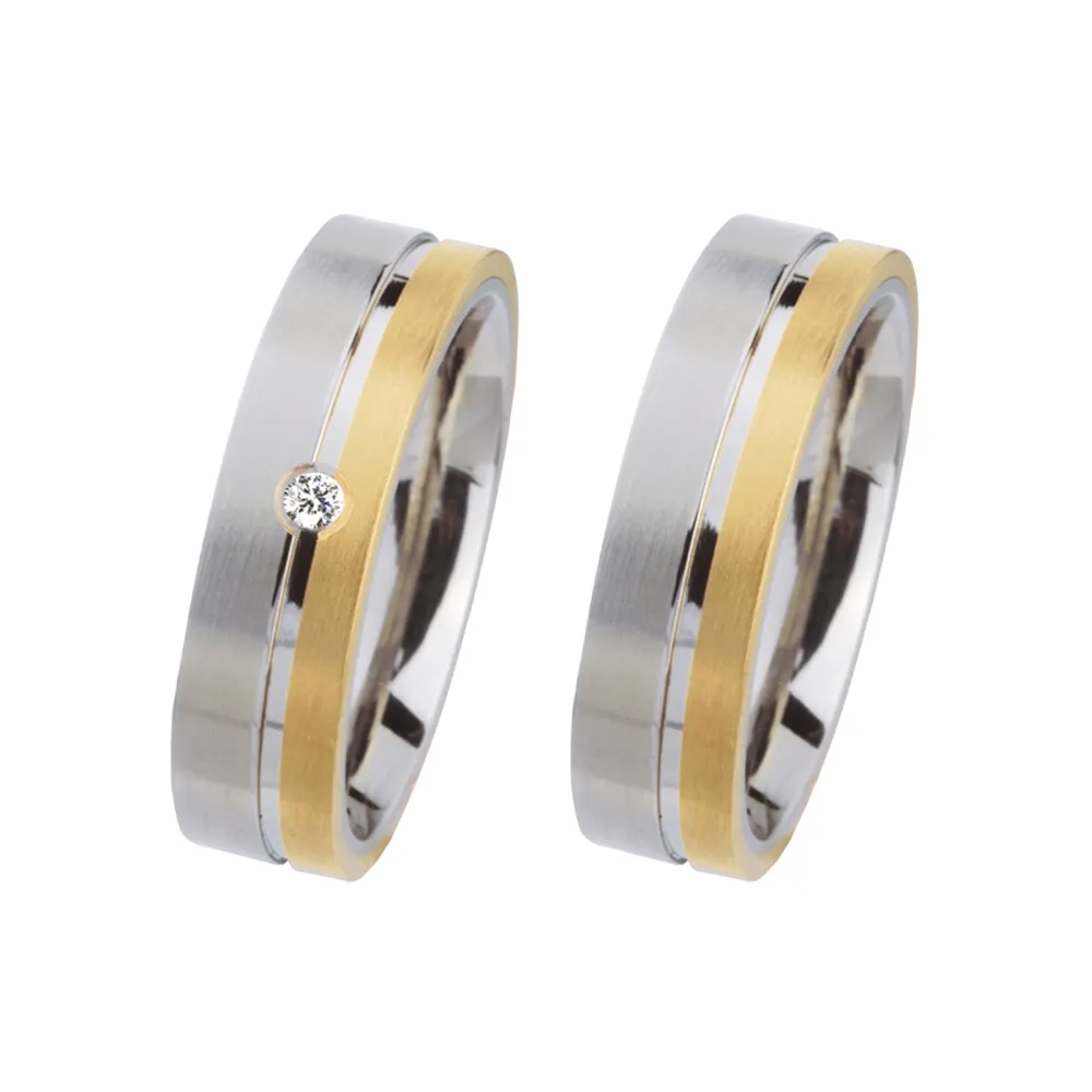Alianzas de boda de acero y oro amarillo con diamante