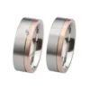 Alianzas de boda de acero y oro rosado con diamante