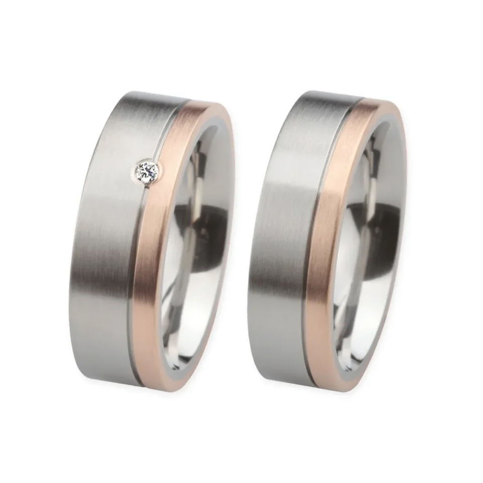 Alianzas de boda de acero y oro rosado con diamante