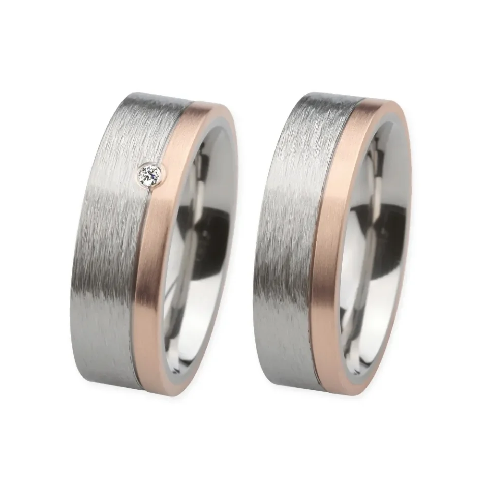Alianzas de boda de acero y oro rosado con diamante