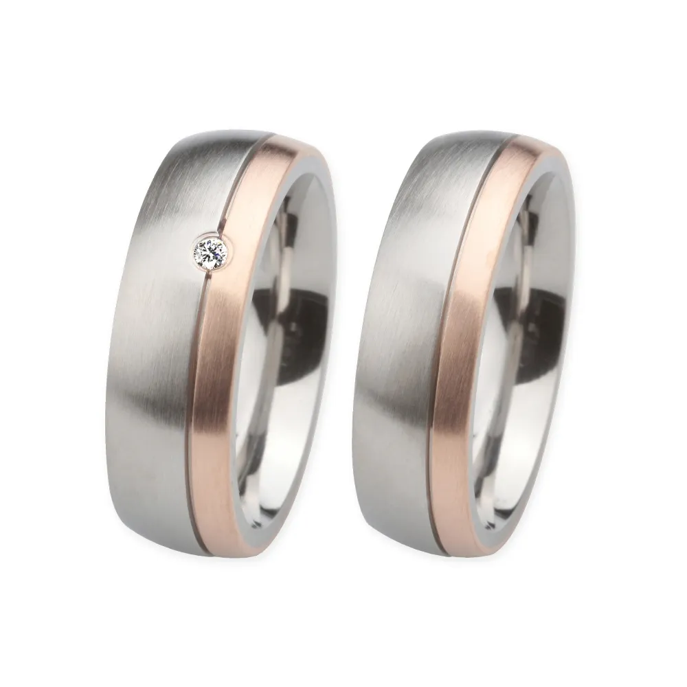 Alianzas de boda de acero y oro rosado con diamante