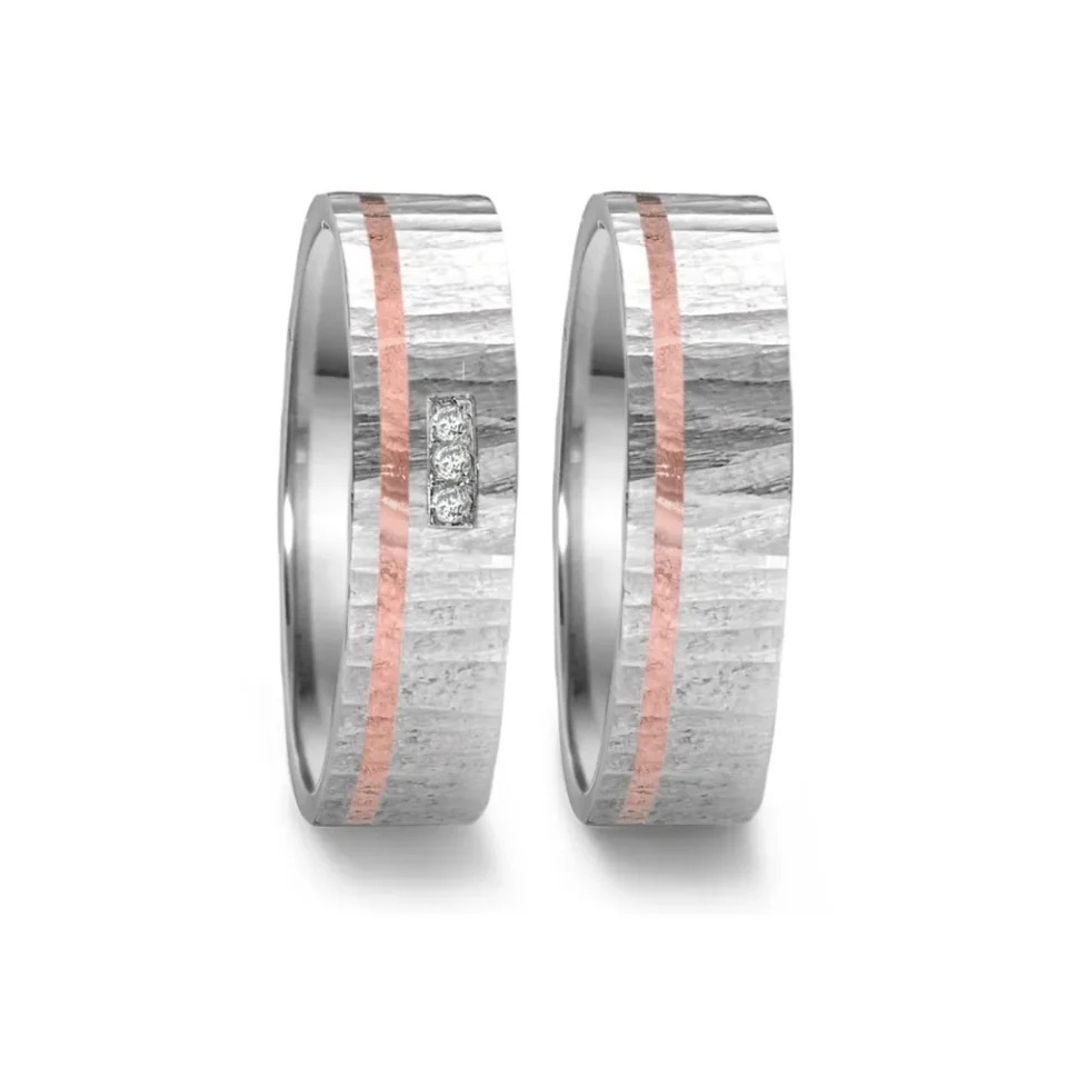 Alianzas de boda de acero y oro rosado con diamantes
