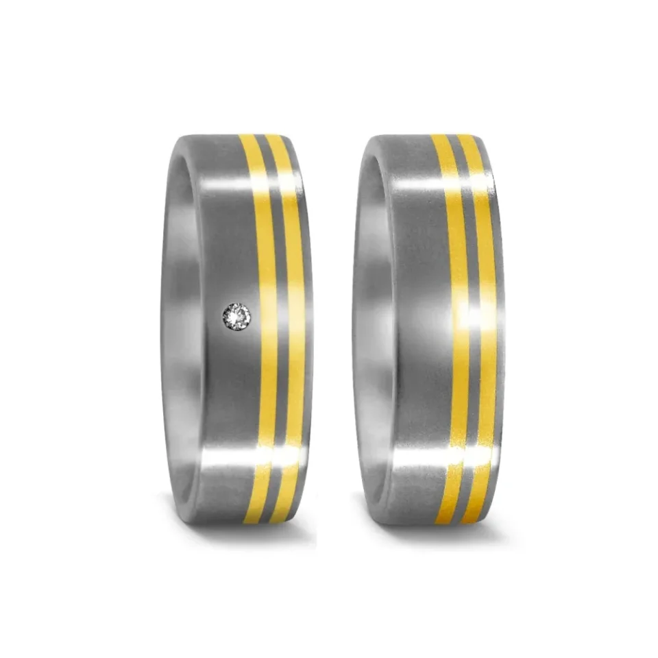 Alianzas de boda de titanio y oro amarillo con diamante