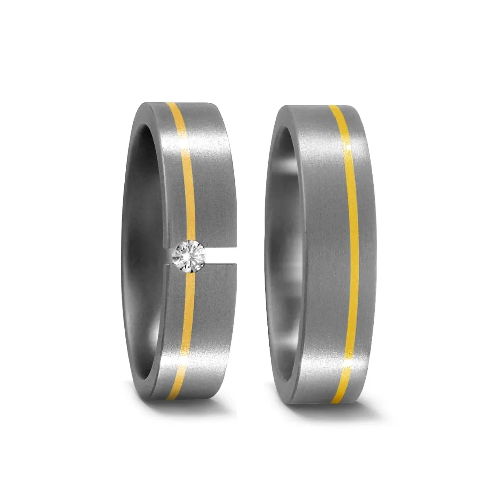 Alianzas de boda de titanio y oro amarillo con diamante