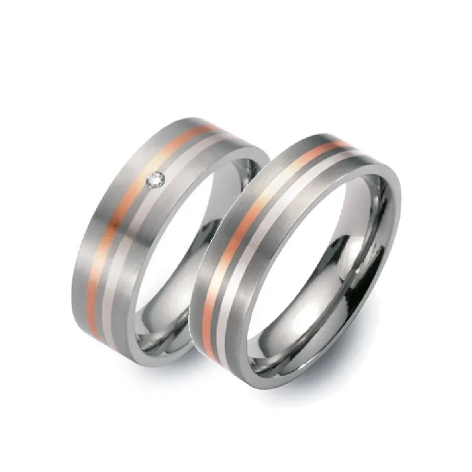 Alianzas de boda de titanio, oro rosado y paladio con diamante