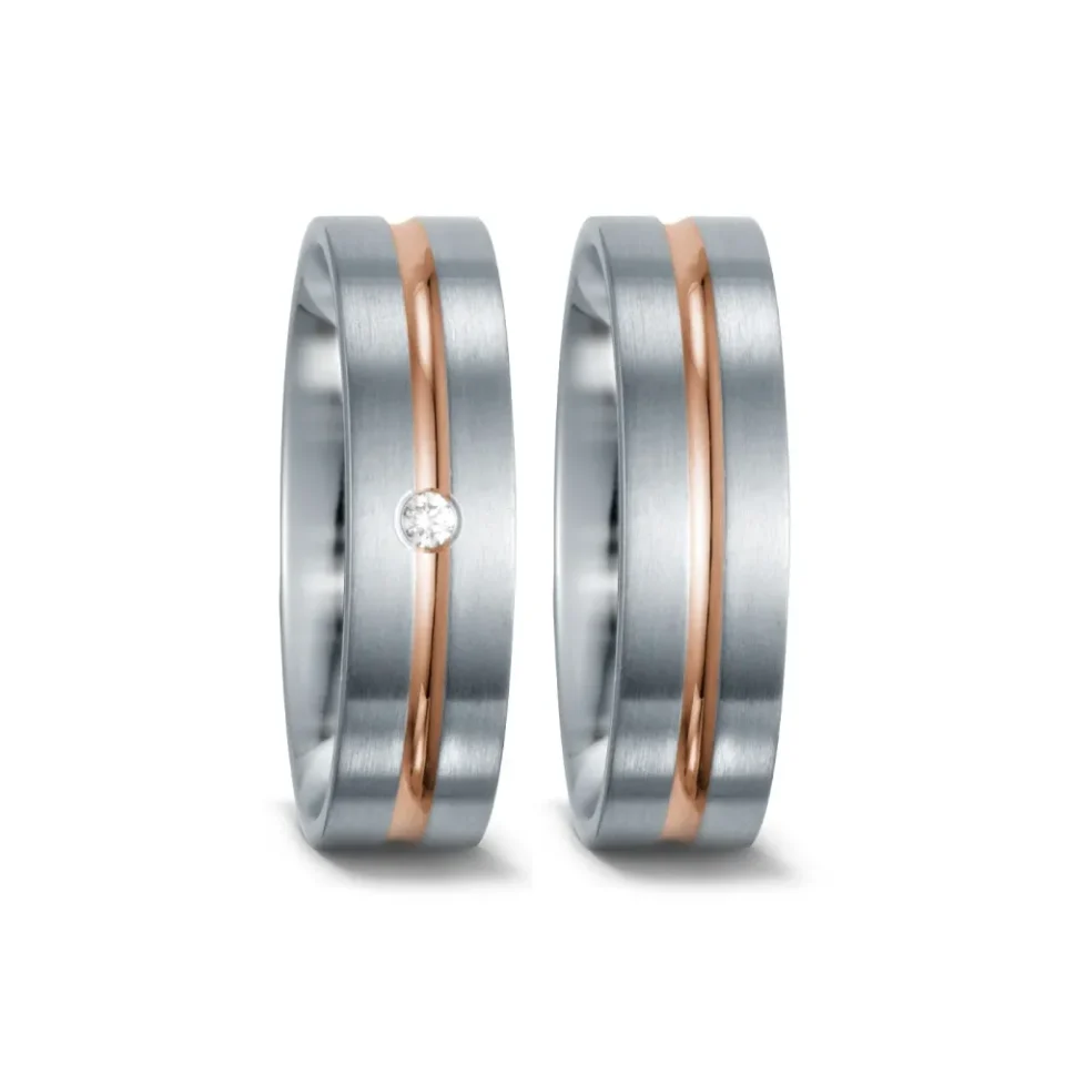 Alianzas de boda de acero y oro rosado con diamante
