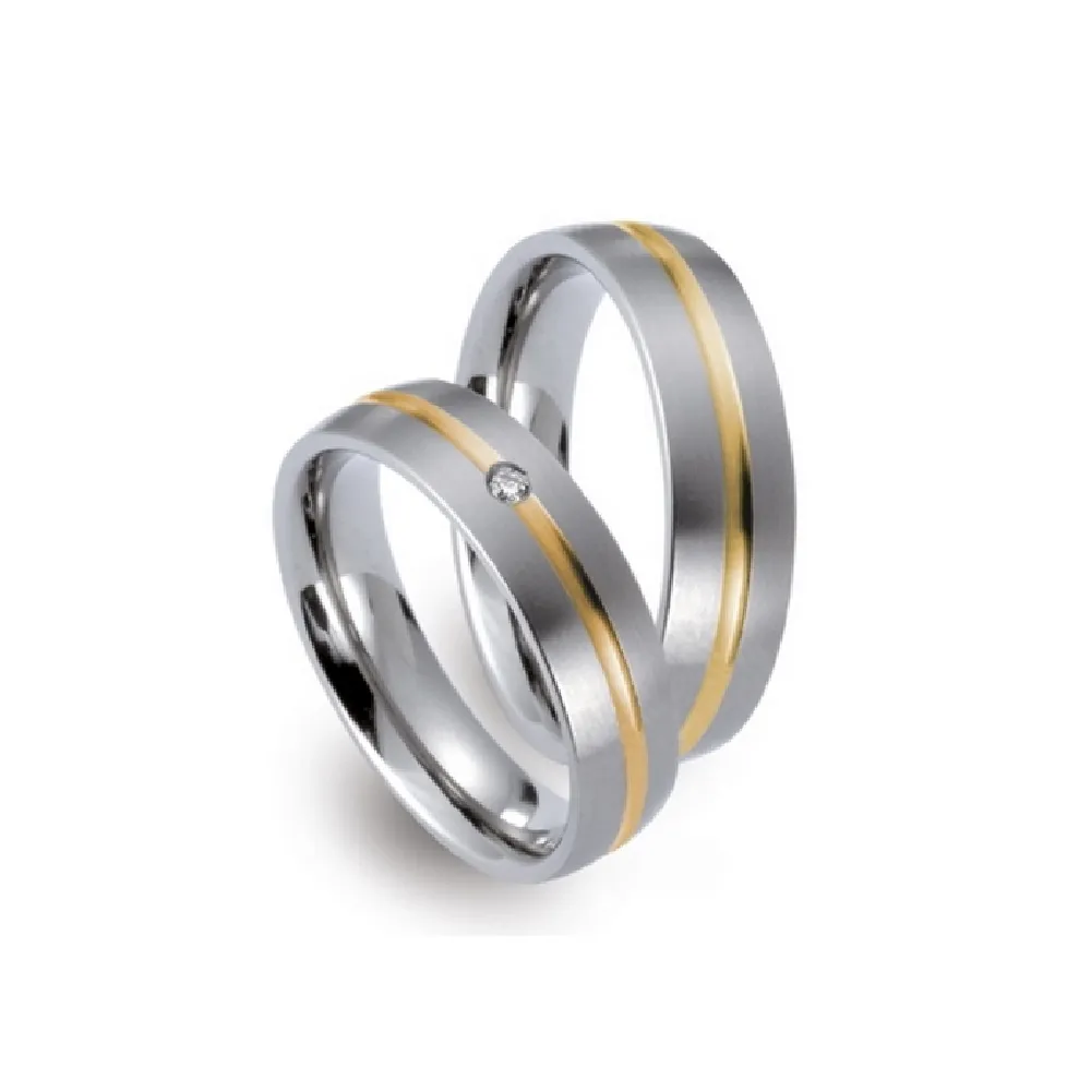 Alianzas de boda de titanio y oro amarillo con diamante