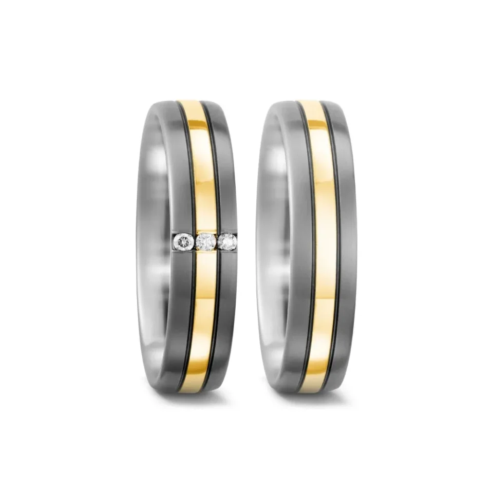 Alianzas de boda de titanio y oro amarillo con diamantes