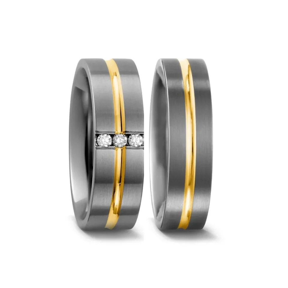 Alianzas de boda de titanio y oro amarillo con diamantes