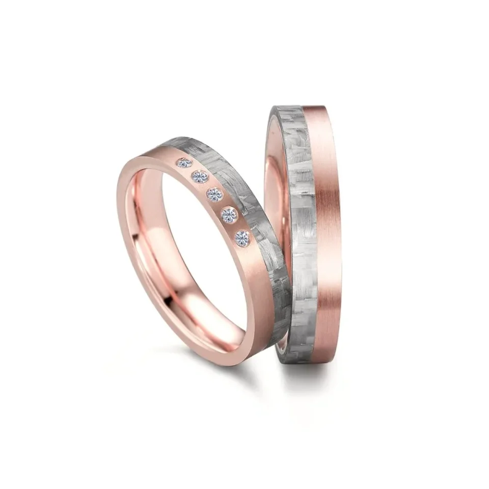 Alianzas de boda de carbono y oro rosado con diamantes