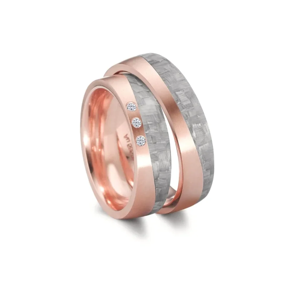 Alianzas de boda de carbono y oro rosado con diamantes