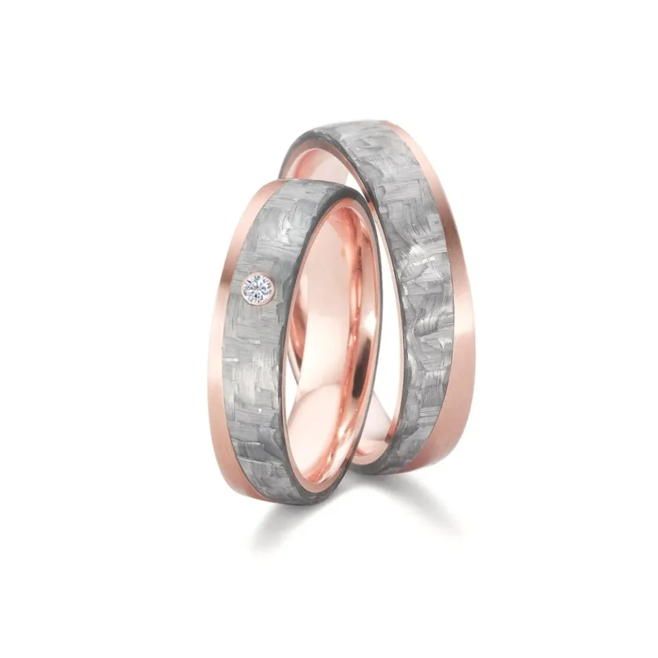 Alianzas de boda de carbono y oro rosado con diamante