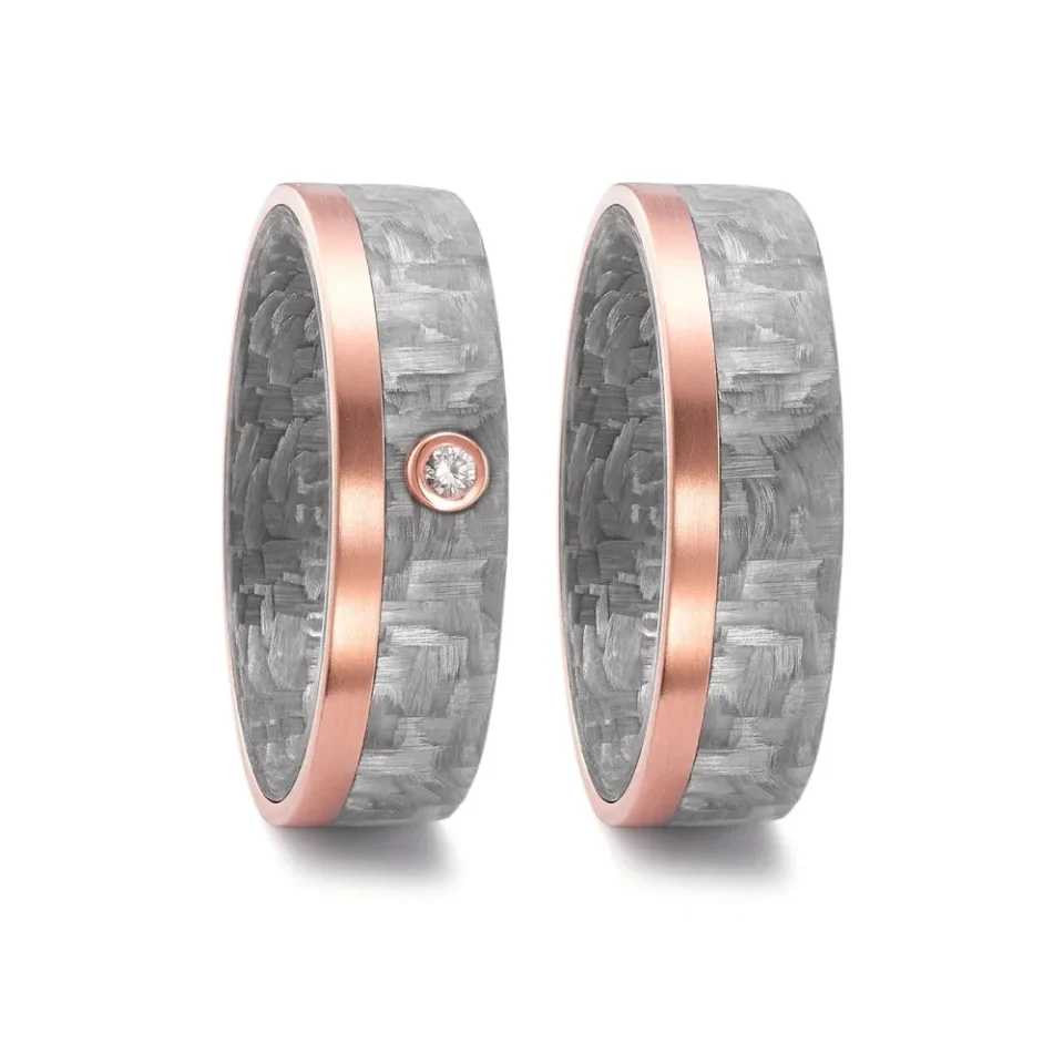 Alianzas de boda de carbono y oro rosado con diamante