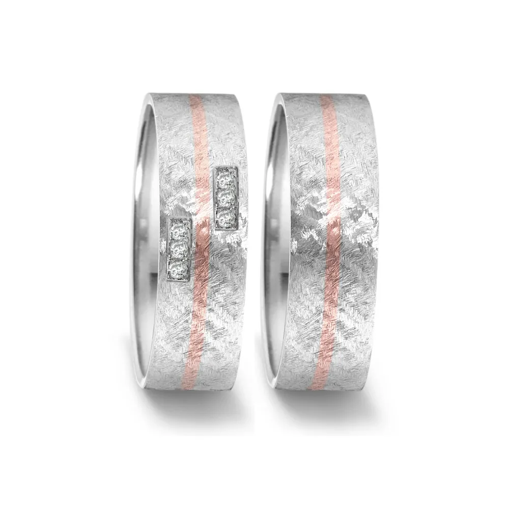 Alianzas de boda de acero y oro rosado con diamantes