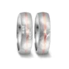 Alianzas de boda de acero y oro rosado con diamantes