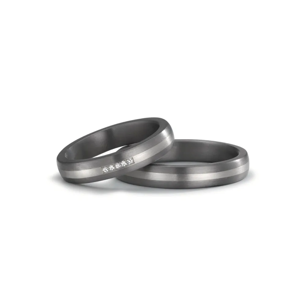 Alianzas de boda de tántalo y platino con diamantes