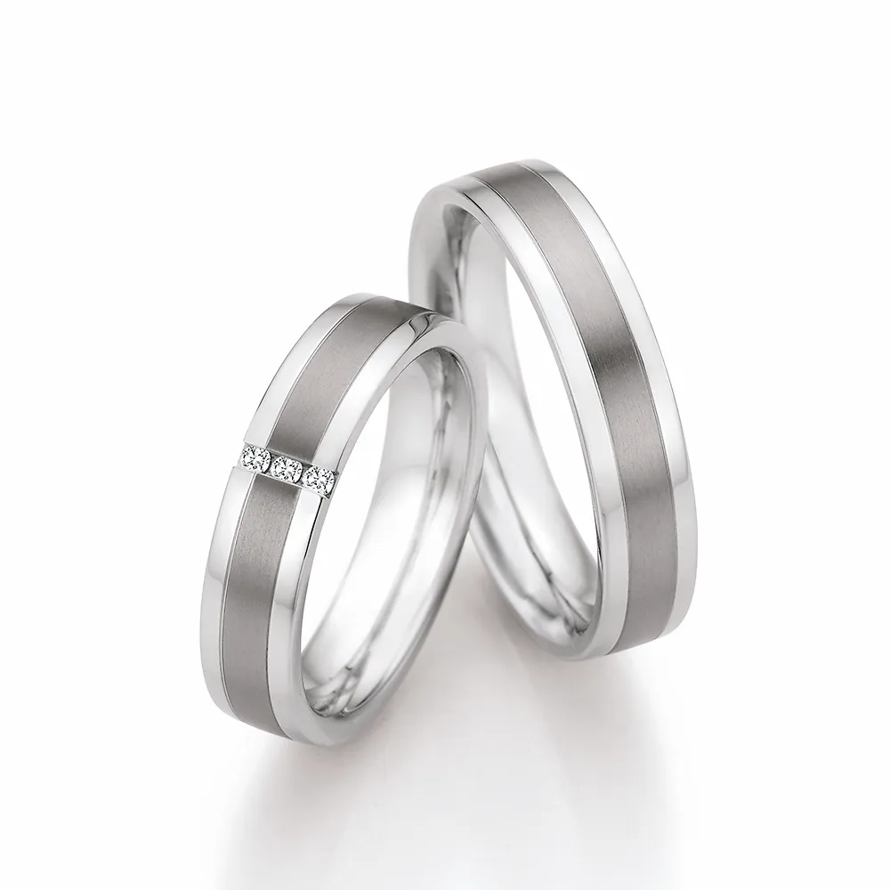 Alianzas de boda de acero y titanio con diamantes