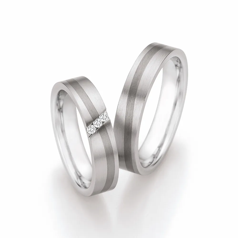 Alianzas de boda de acero y titanio con diamantes