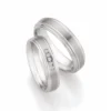 Alianzas de boda de acero y titanio con diamantes