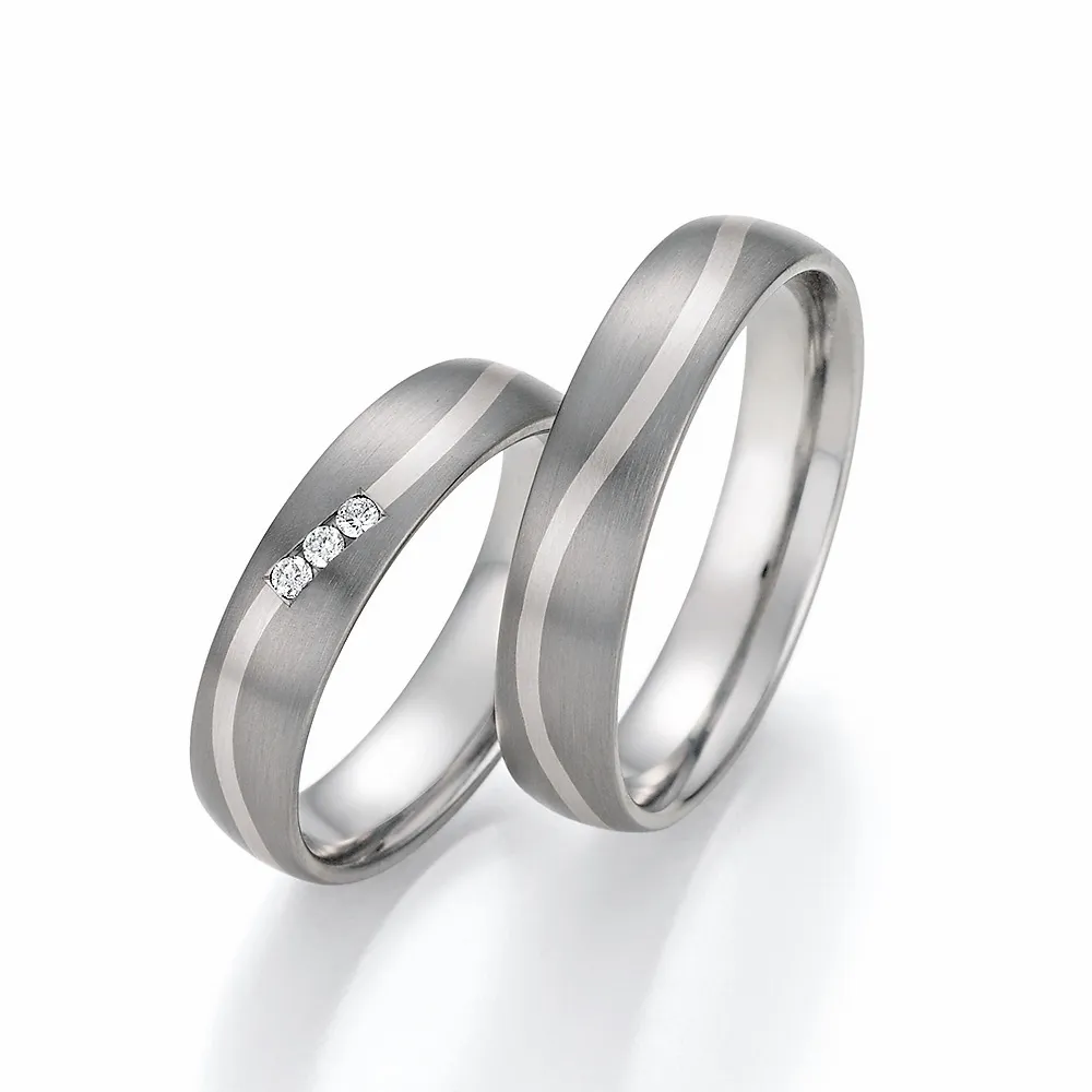 Alianzas de boda de titanio y oro blanco con diamantes
