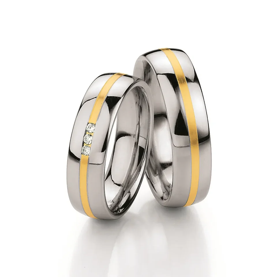 Alianzas de boda de acero y oro amarillo con diamantes