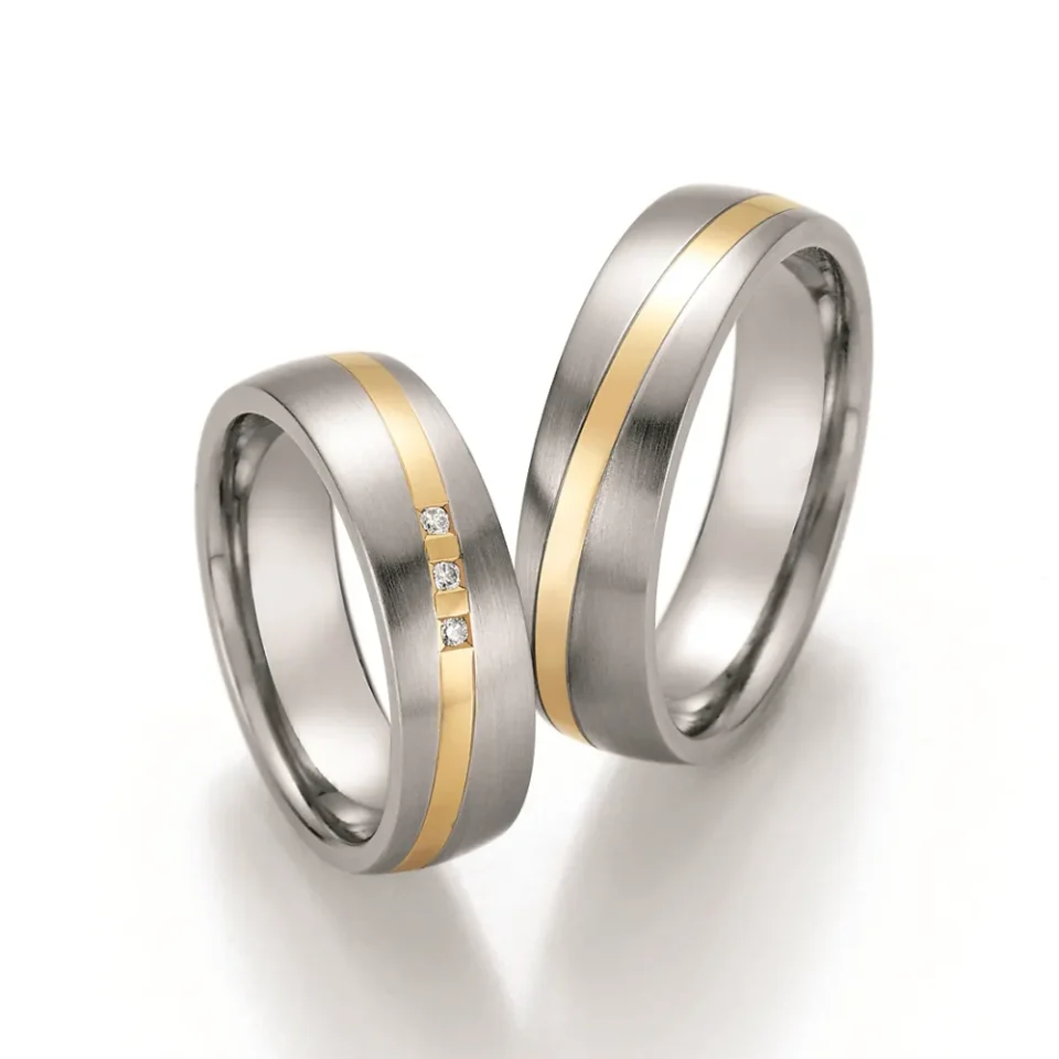 Alianzas de boda de acero y oro amarillo con diamantes
