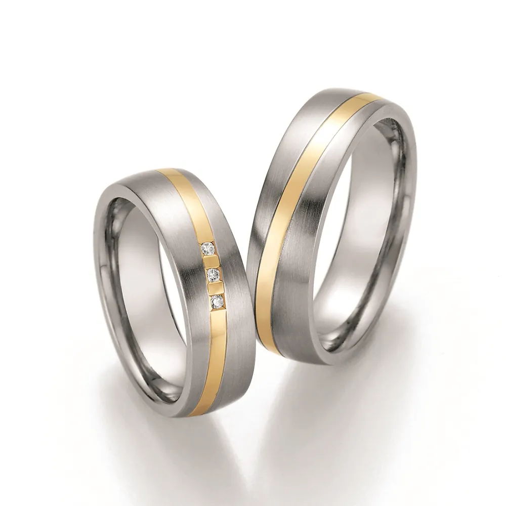 Alianzas de boda de acero y oro amarillo con diamantes